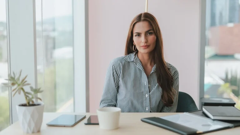 Practice director seated at a desk in a calm, modern office