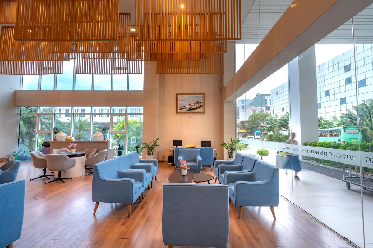 Bright lounge with blue sofas and wooden accents suggesting a calm waiting area