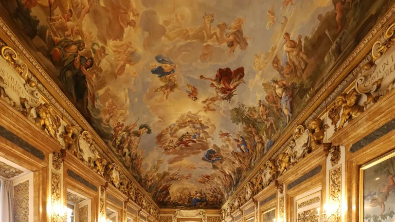 Frescoed palace gallery with gilded walls and a polished floor