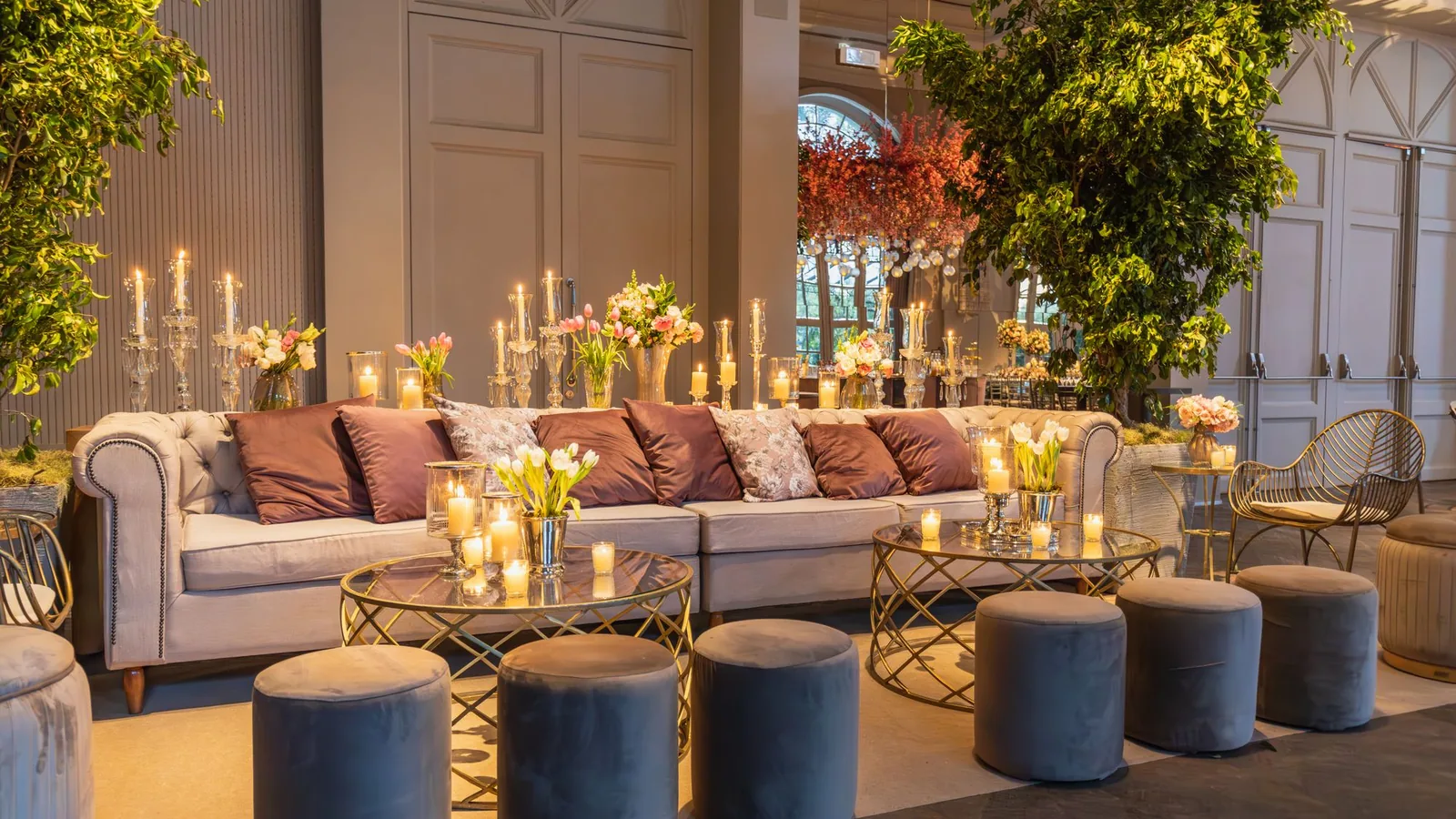 Luxe lounge with plush seating, brass accents and fresh florals