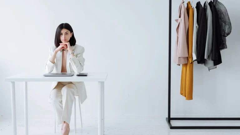 Business owner in a tailored suit at a minimalist desk